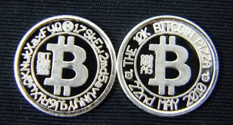 Two Bitcoin Nerd silver rounds showing the Bitcoin Pizza commemorative design and the opposite Bitcoin design with a Bitcoin-address inscription.